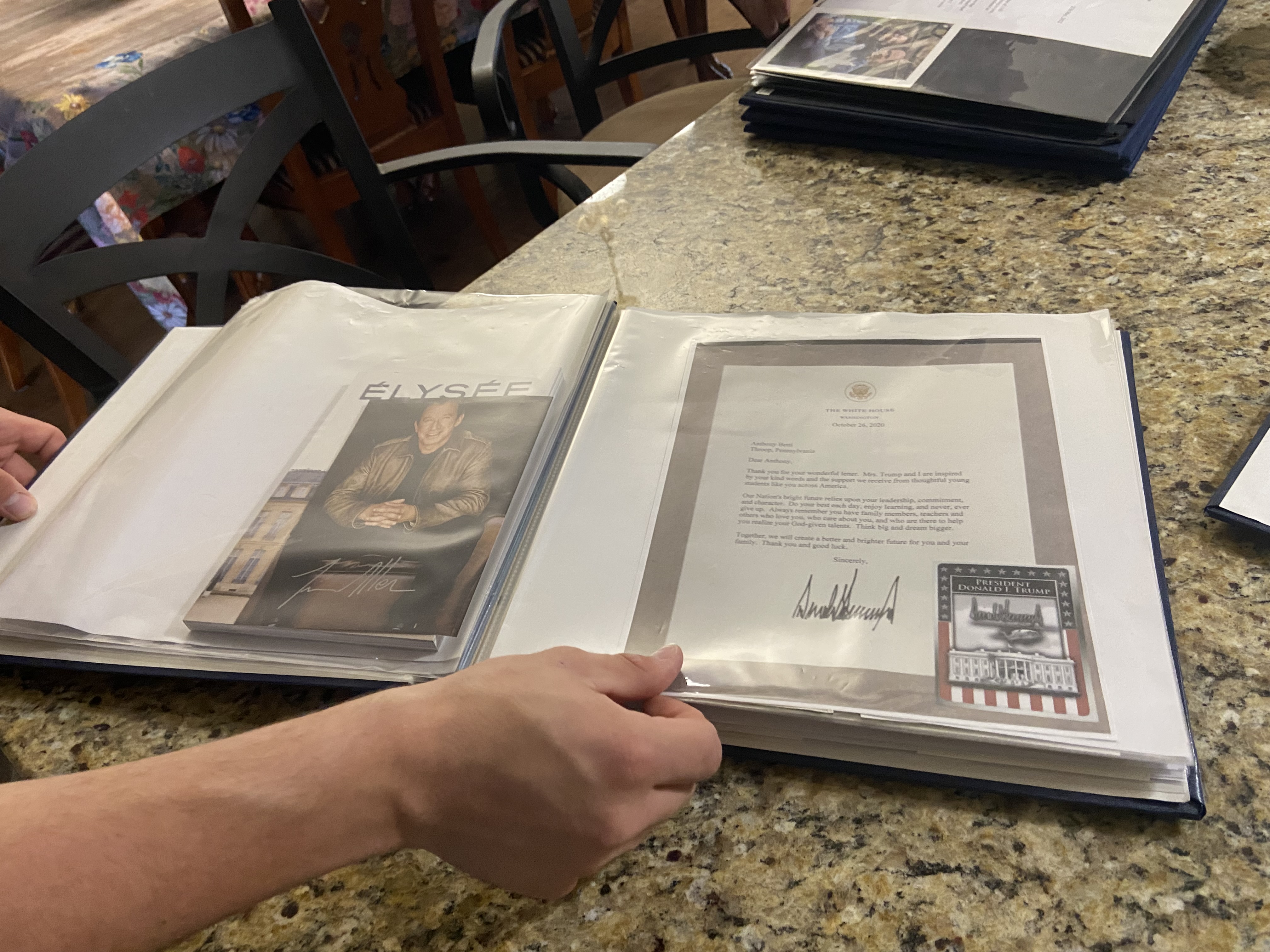 Anthony Betti shows a scrapbook of autographed letters from various...