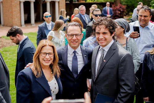 Anthony Betti, right, poses for a photo with Gov. Josh...