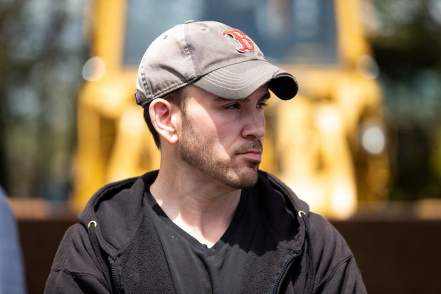 Walter Stocki, Jr., owner of Scrap Enterprises, looks on as The Honorable Thomas J. Munley tours his property which the court considers an illegal junkyard off Keyser Avenue in Old Forge on Thursday, May 2, 2019. (TIMES-TRIBUNE / FILE PHOTO)
