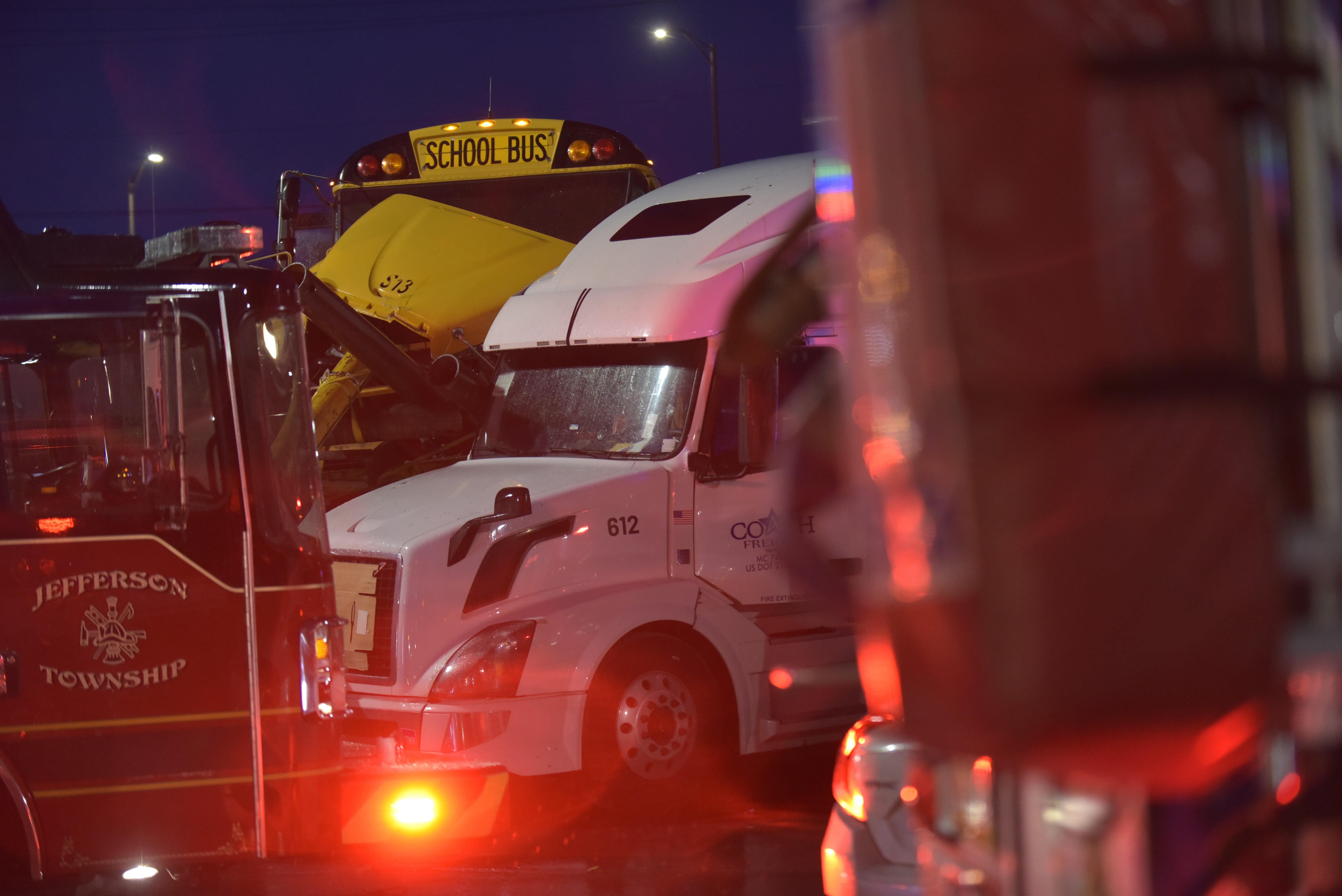 A school bus crashed into a parked tractor trailer at...