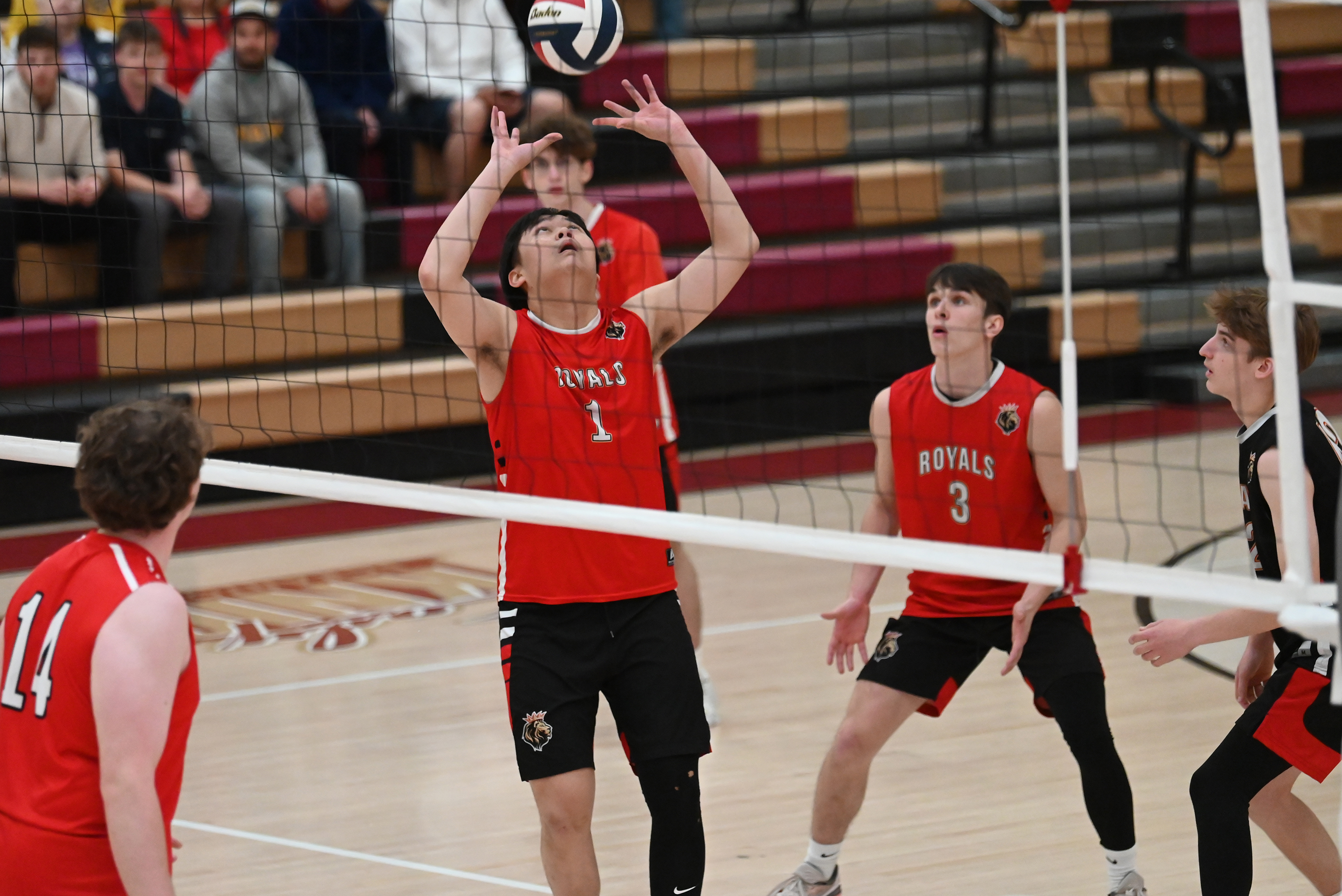 Holy Redeemer’s Koirey Tang sets the ball during the 2A...