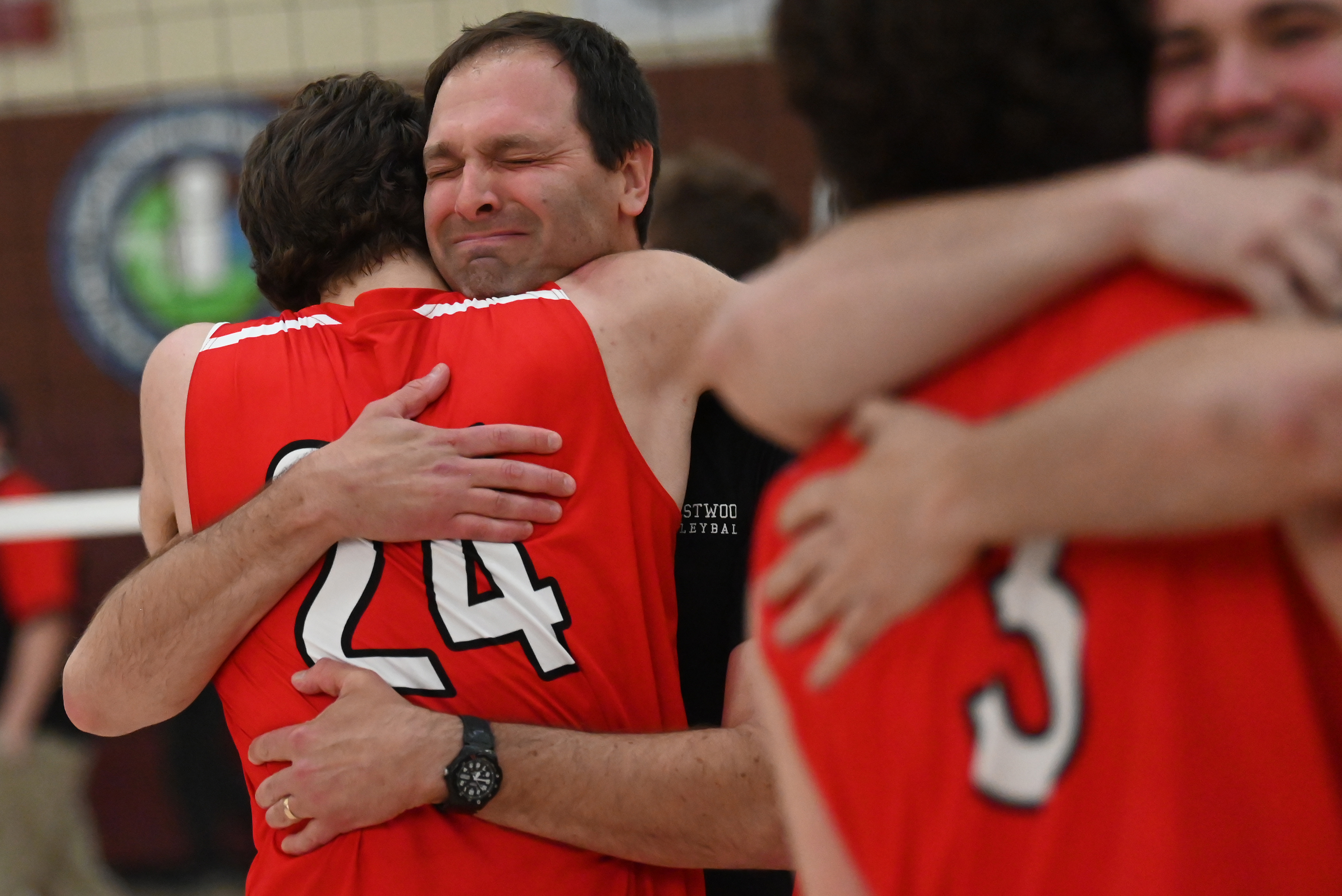 Crestwood’s head coach Jeff Stec hugs JJ Stec after his...