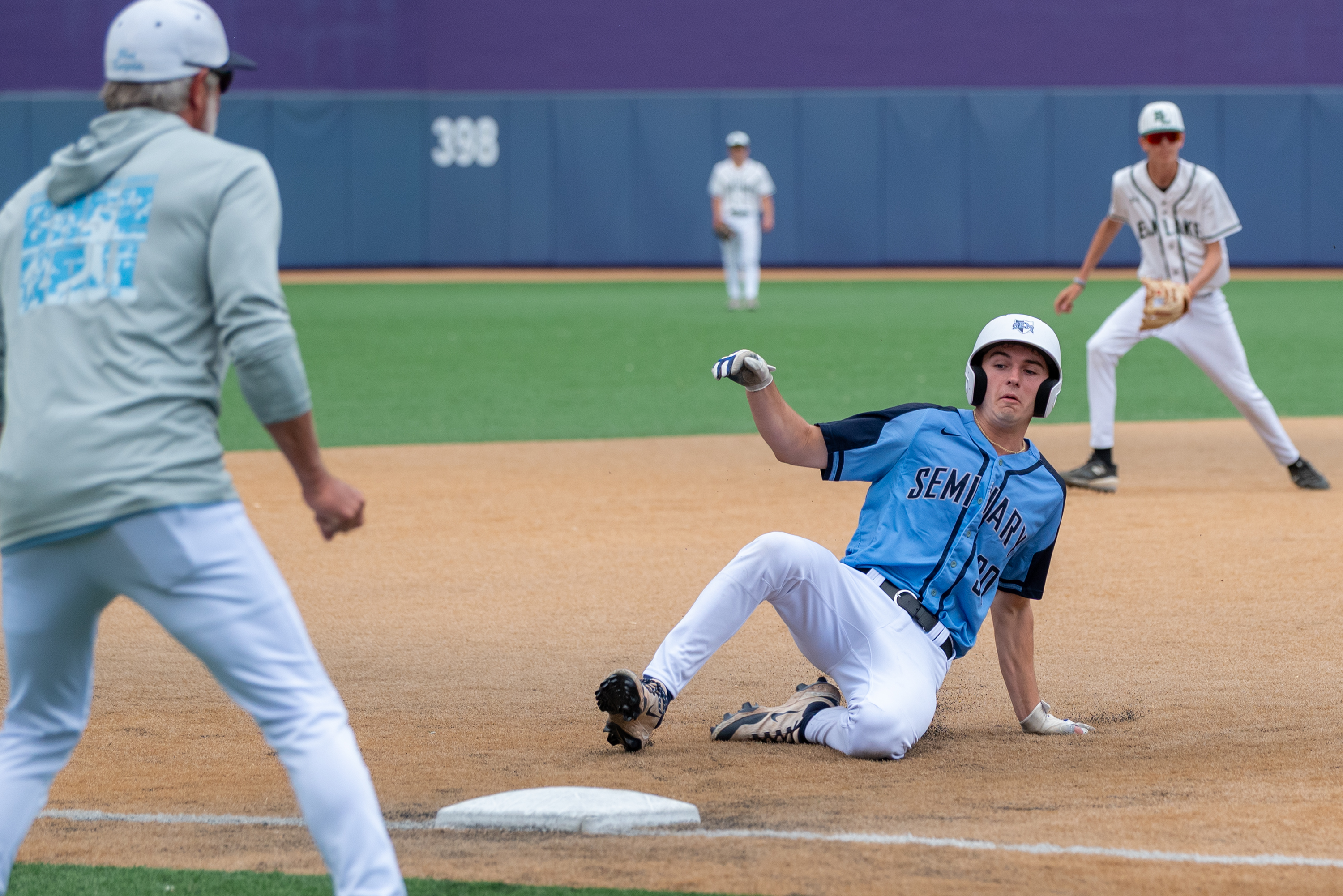 Wyoming Seminary’s Ryan Finlay slides into third during the District...
