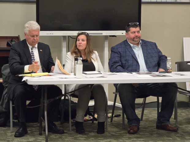 (Left to right) Dickson City Development LLC attorney Michael Mey, senior program manager Jennifer Leonard of KCI Technologies and Kriger Construction Vice President David Stiles prepare for their presentation during a zoning hearing Wednesday, April 29, 2026, at the Dickson City Borough Building. (FRANK WILKES LESNEFSKY / STAFF PHOTO)