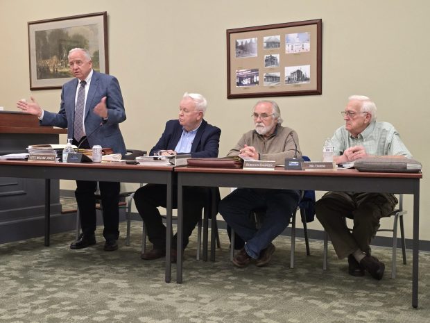 Dickson City Solicitor Bill Jones, standing, speaks during a zoning hearing Wednesday, April 29, 2026, at the Dickson City Borough Building. (FRANK WILKES LESNEFSKY / STAFF PHOTO)