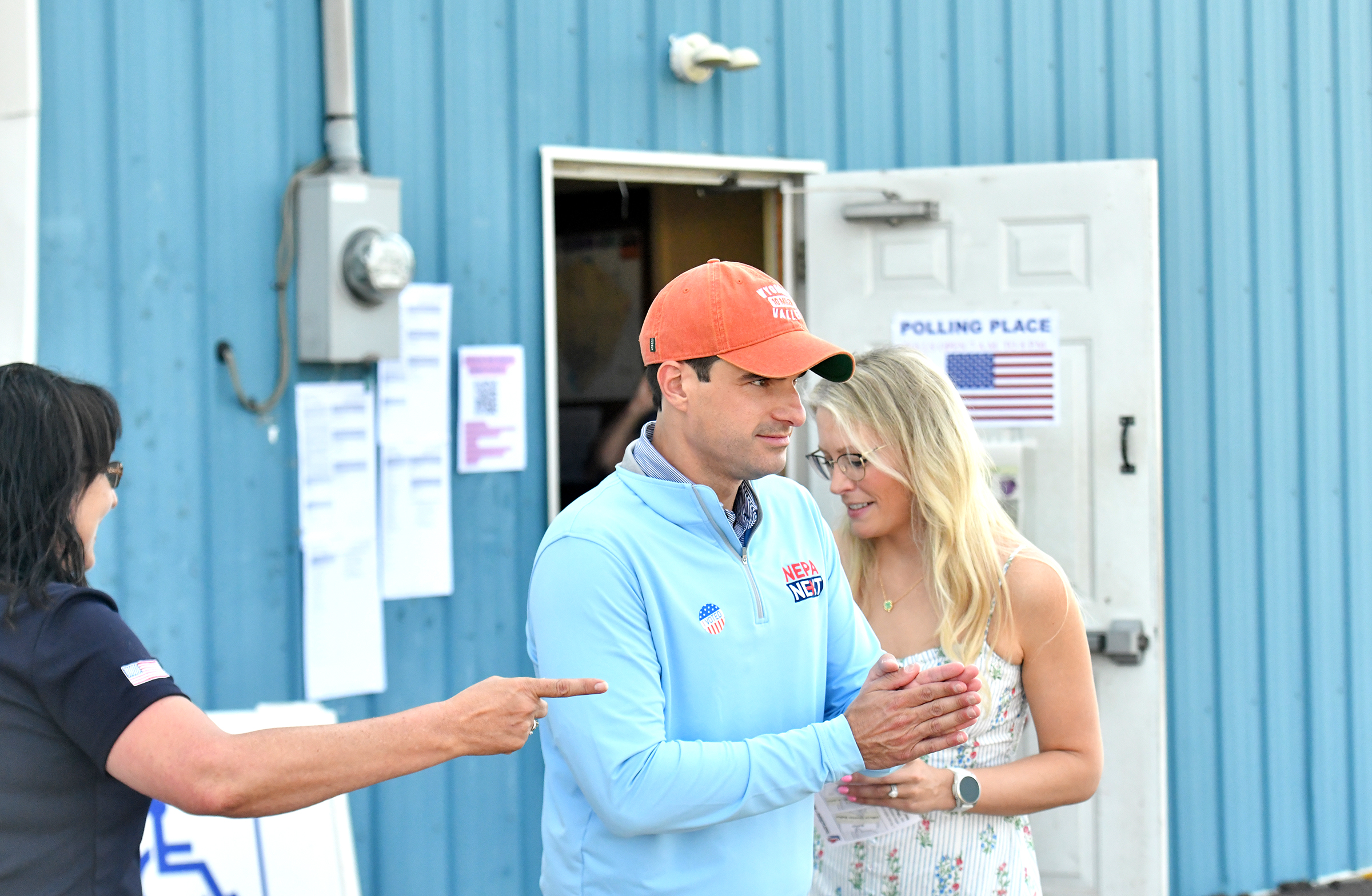 U.S. Rep. Rob Bresnahan finishes voting with his wife Chelsea...