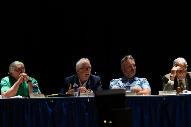 Archbald Councilman Larry Marchetti, second from left, questions Essential Energy LLC officials during a conditional use hearing in the Valley View High School auditorium in Archbald to consider the 400-megawatt natural gas power plant on Thursday, May 21, 2026. (FRANK WILKES LESNEFSKY / STAFF PHOTO)