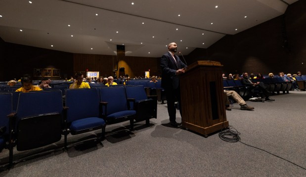 Attorney Justin Richards, who represents borough residents fighting data centers, cross examines Essential Energy LLC witnesses during a conditional use hearing in the Valley View High School auditorium in Archbald to consider the 400-megawatt natural gas power plant on Thursday, May 21, 2026. (FRANK WILKES LESNEFSKY / STAFF PHOTO)
