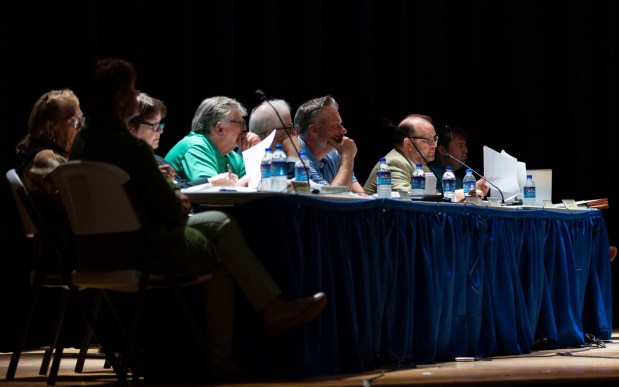 Archbald officials listen to testimony during a conditional use hearing in the Valley View High School auditorium in Archbald as council considers Essential Energy LLC's 400-megawatt natural gas power plant on Thursday, May 21, 2026. (FRANK WILKES LESNEFSKY / STAFF PHOTO)