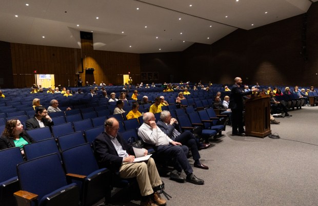 Attorney Justin Richards, who represents borough residents fighting data centers, cross examines Essential Energy LLC witnesses during a conditional use hearing in the Valley View High School auditorium in Archbald to consider the 400-megawatt natural gas power plant on Thursday, May 21, 2026. (FRANK WILKES LESNEFSKY / STAFF PHOTO)