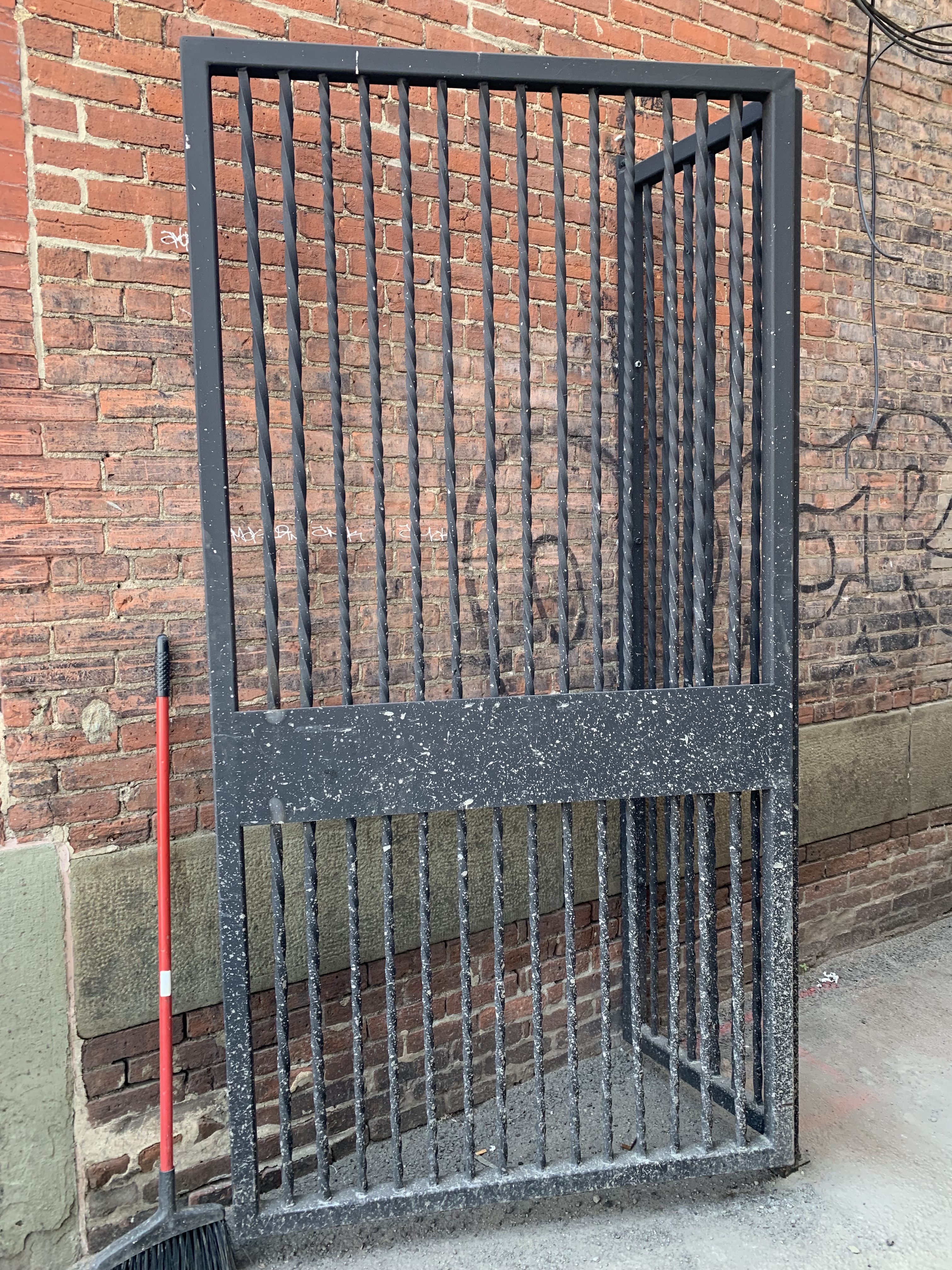 A newly installed gate at the narrow Howley Court passageway...