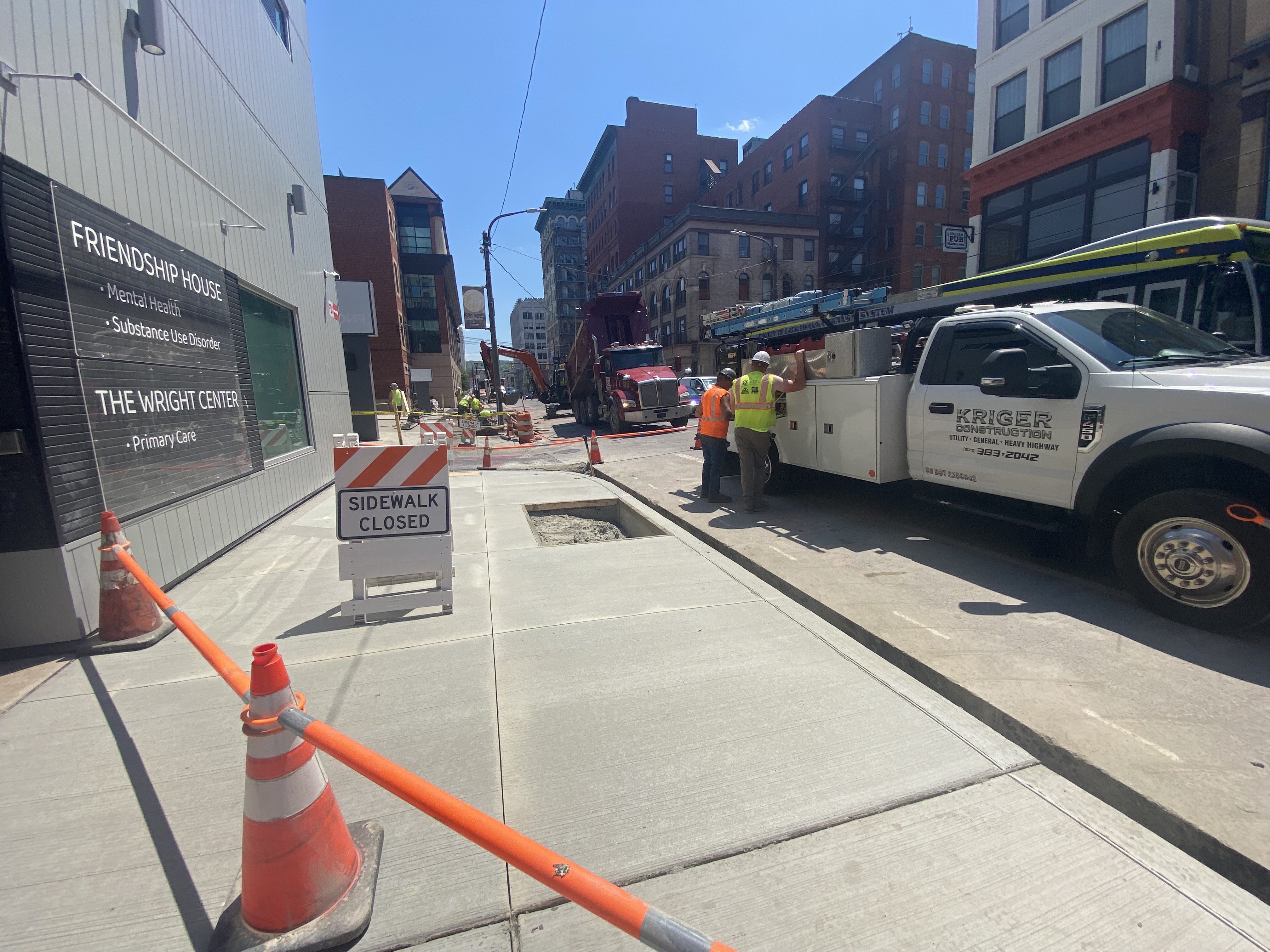 A crew from Kriger Construction works on a streetscape project...