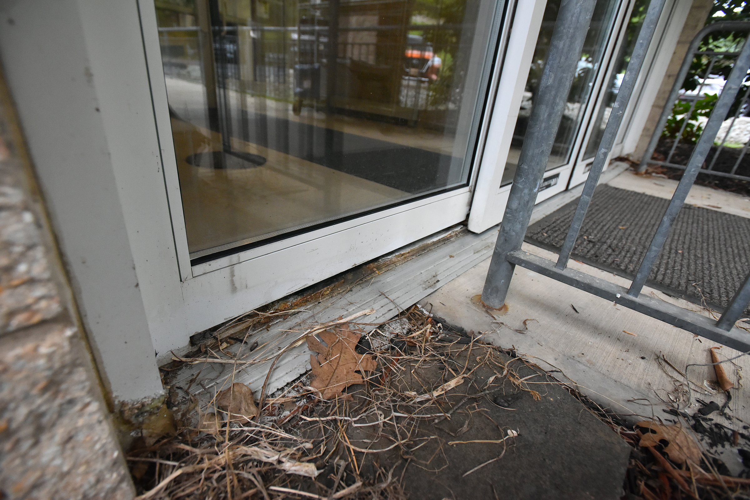 The bottom of the front door is damaged at the...