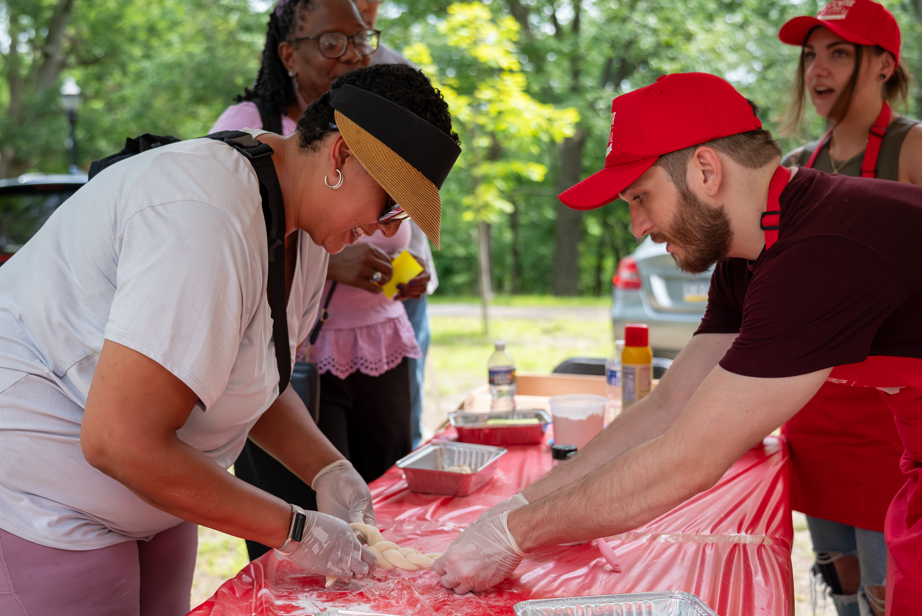 Tirsa Rothman braids challah at the Jewish Food Festival at...