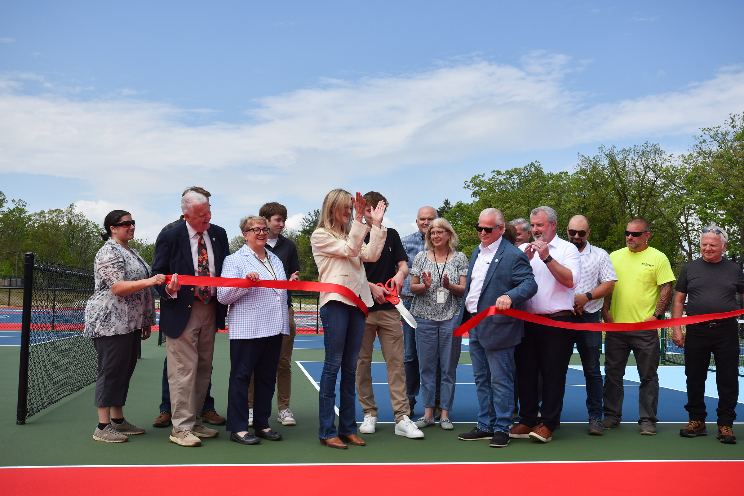 Scranton Mayor Paige Gebhardt Cognetti, center, applauds after cutting the...