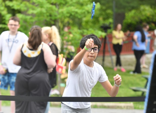 Scranton Cyber Academy student David Pulido, 13, of Scranton, plays a game during the school's picnic at Nay Aug Park in Scranton Wednesday, May 27, 2026. (SEAN MCKEAG / STAFF PHOTOGRAPHER)