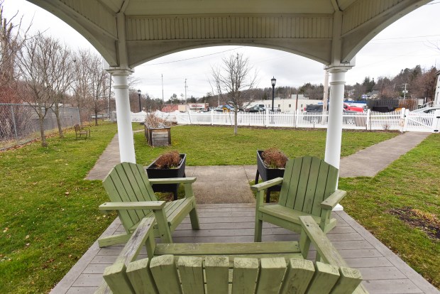 A view through the gazebo at Finish Shop Pocket Park on Depot St. in Clarks Summit Friday, March 27, 2026. (SEAN MCKEAG / STAFF PHOTOGRAPHER)