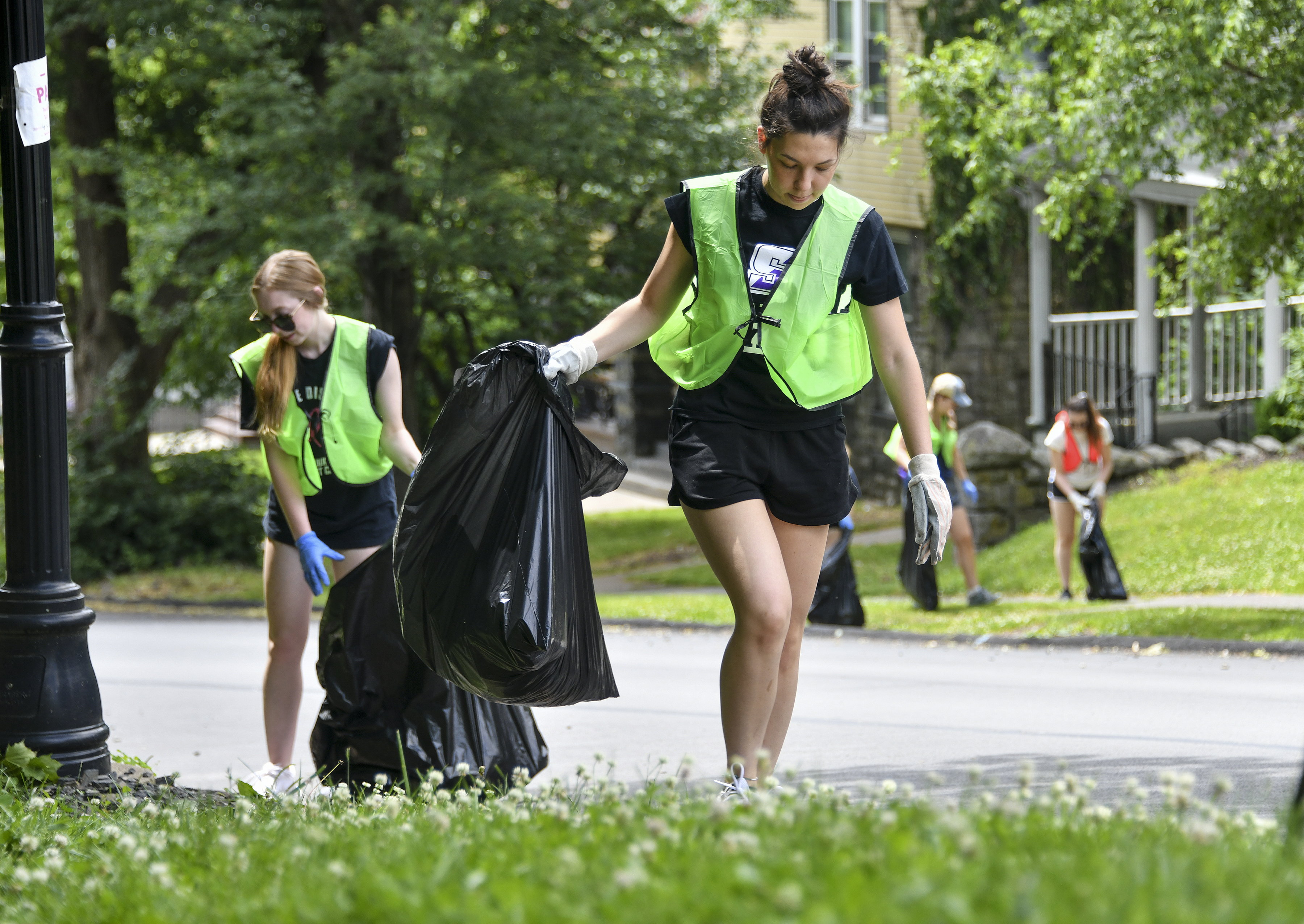 Julia Lemay and other University of Scranton students cleanup trash...