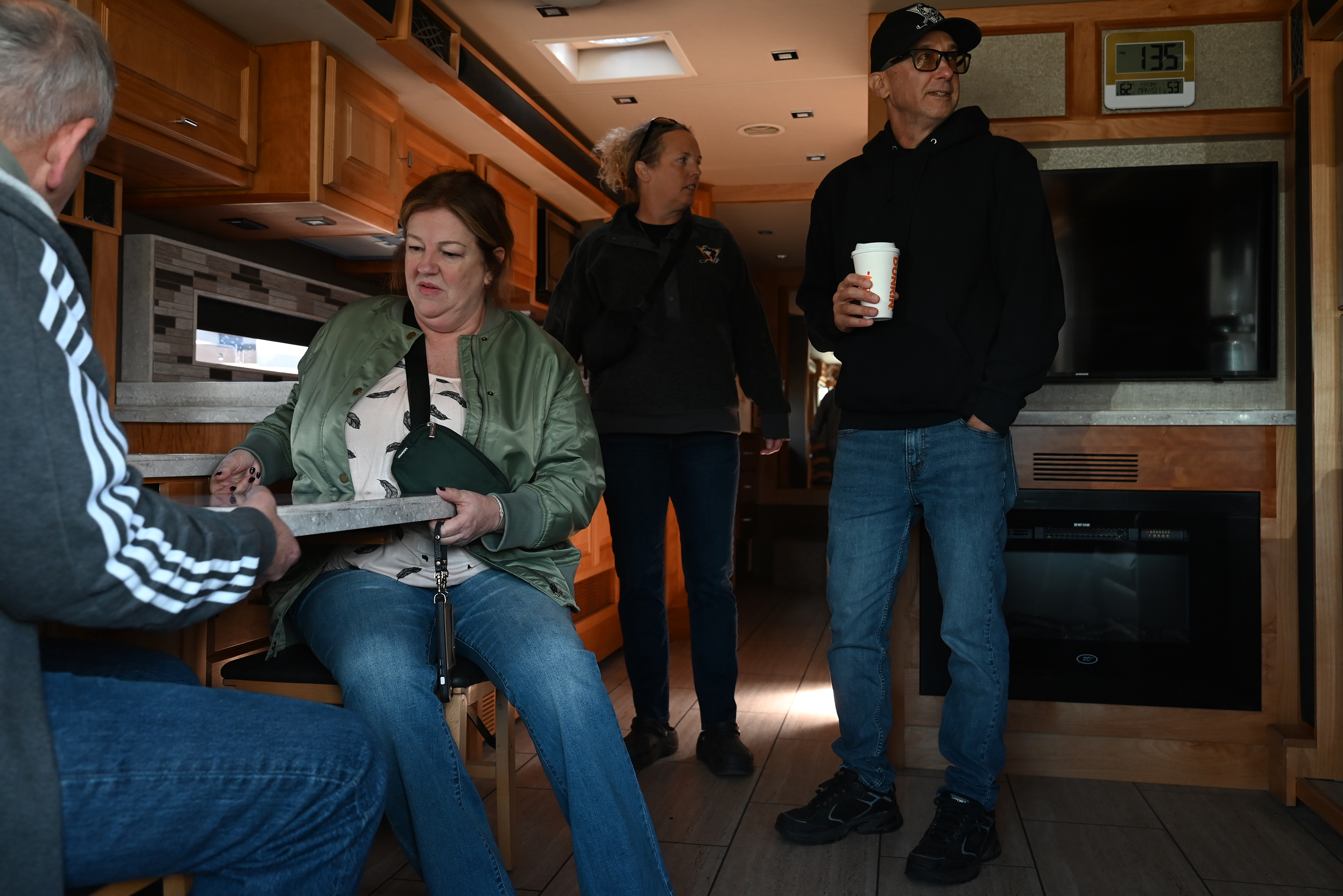 Friends Peter and Linda Gill, left, and Greg Demiceli and...