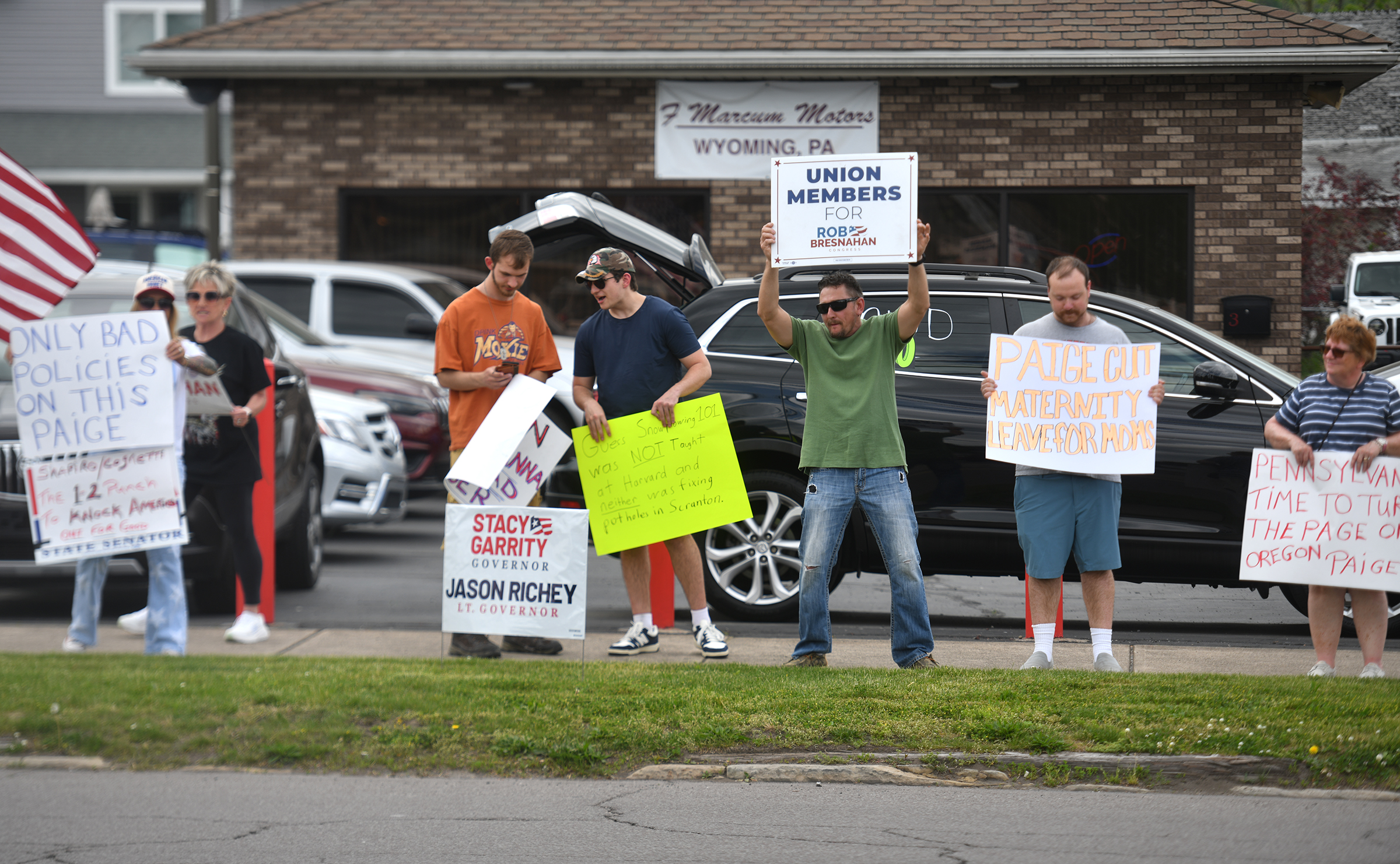 Protesters gather outside of The Avenue Restaurant & Catering in...