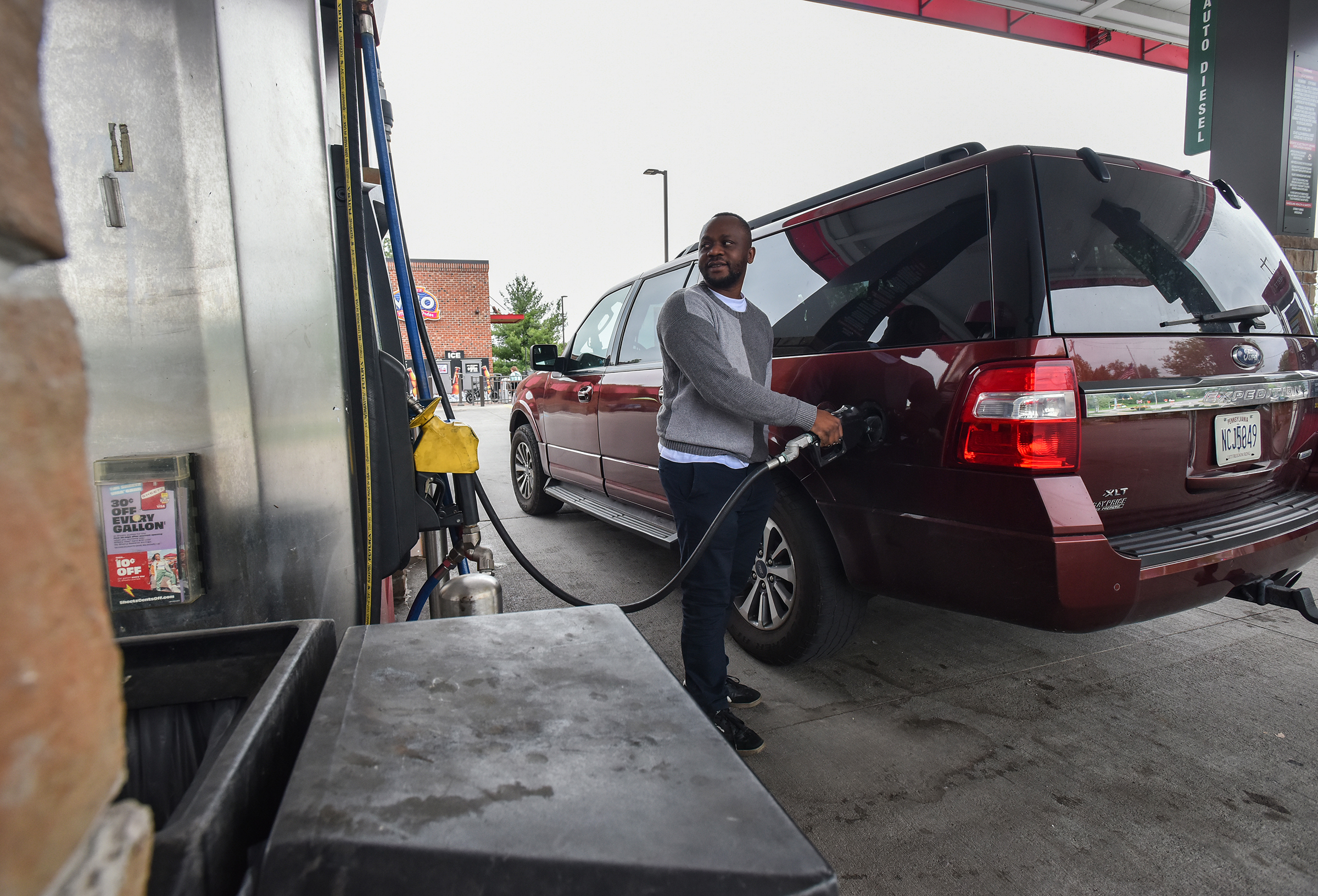 Jures Makena, of Scranton, fills up his vehicle at the...