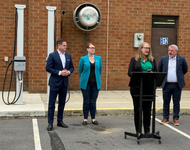 Katie Blume, political and legislative director for Conservation Voters of Pennsylvania, provides remarks during a news conference with state legislators and advocates Thursday morning, on the grounds of the Mid Valley School District in Throop, aimed at urging elected officials in the state and country to take action on proposed bills to help lower energy prices and save Pennsylvanians money at the pump. (ROBERT TOMKAVAGE/STAFF PHOTO)