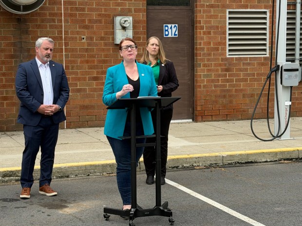 Alisha Hoffman-Mirilovich, executive director for Action Together NEPA, provides remarks during a news conference with state legislators and advocates Thursday morning, on the grounds of the Mid Valley School District in Throop, aimed at urging elected officials in the state and country to take action on proposed bills to help lower energy prices and save Pennsylvanians money at the pump. (ROBERT TOMKAVAGE/STAFF PHOTO)