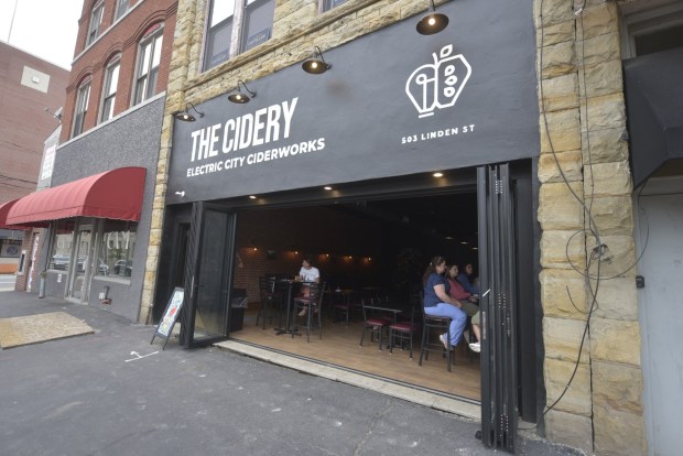 People enjoy an evening at Electric City Ciderworks on Linden Street in downtown Scranton. (CHAD SEBRING/STAFF PHOTO)