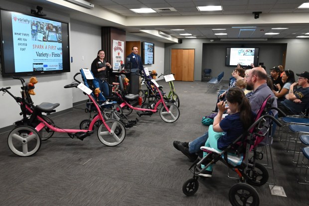 Variety the Children's Charity CEO Tom Baker and Program Manger Molly Crawford share stories about other families that received equipment from the organization at Northeastern Educational Intermediate Unit in Archbald on Tuesday, May 5, 2026. Three local families received adaptative bikes and four received strollers. (REBECCA PARTICKA/STAFF PHOTOGRAPHER)