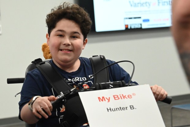 Hunter Benson, 13, smiles for the camera as he sits on his new bike at Northeastern Educational Intermediate Unit in Archbald on Tuesday, May 5, 2026. Benson says it feels good to get a new set of wheels. (REBECCA PARTICKA/STAFF PHOTOGRAPHER)