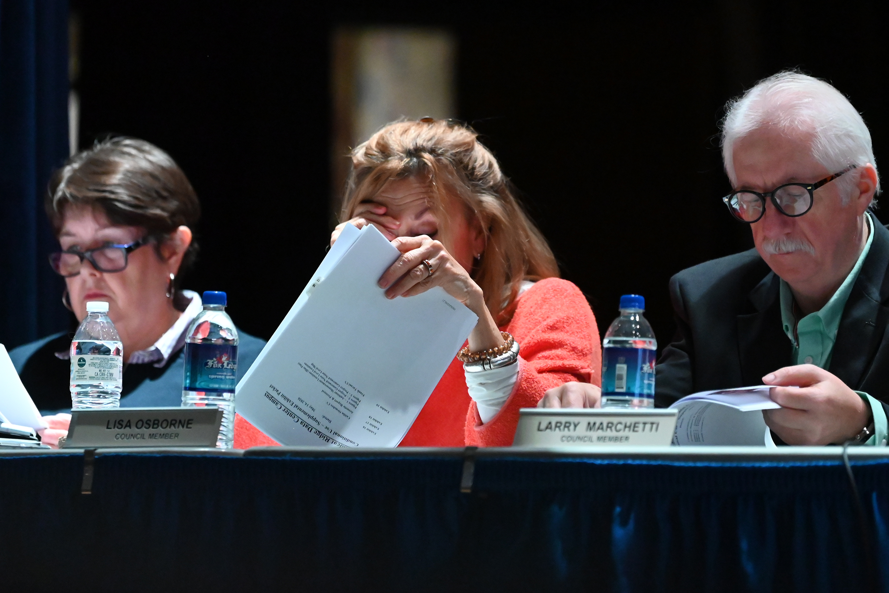 Borough councilmembers Madonna Munley, Lisa Osborne, and Larry Marchetti look...