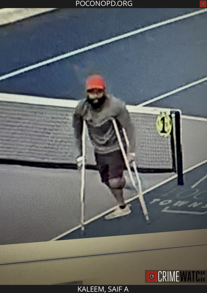 Surveillance image of suspect, Saif A. Kaleem, using crutches on a court.