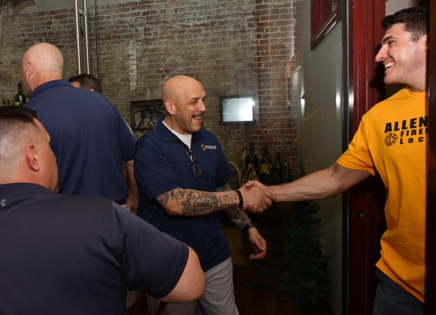 Bethlehem Fire Fighters Union President Lou Jimenez, left, greets his cousin, Allentown firefighter Leroy Bachert Jr., as they wait for former Bethlehem firefighter and Democratic congressional candidate Bob Brooks to arrive at his election party on Primary Day, Tuesday, May 19, 2026, at Artisan in Bethlehem. (Monica Cabrera/The Morning Call)