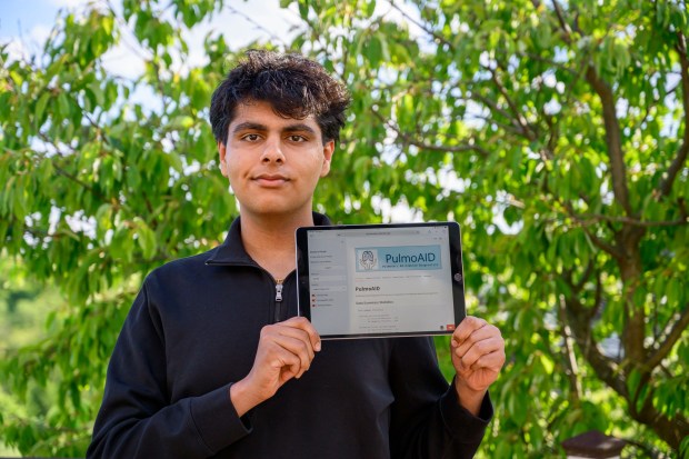 Tushar Mehta, a Parkland High Senior, stands with his iPad on Thursday, May 7, 2026, in Orefield. Mehta recently won the 2026 National STEM Challenge for designing the app PulmoAid, which can help diagnose lung cancer based on medical scans. He previously won the 2022 Congressional App Challenge after designing the app recyclebot. (April Gamiz/The Morning Call)