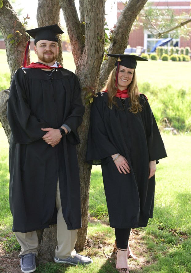 Amy Riley and her son Justin Riley enjoy time Tuesday, May 5, 2026, at DeSales University in Center Valley. They are both graduating with bachelor's degrees in criminal justice from the university, where they helped each other through assignments and pushed each other to succeed. Amy Riley enrolled at DeSales after earning her associate's degree and being a stay-at-home mother for 27 years. Justin Riley transferred via the Aviat Scholarship after working in campus public safety at Lehigh Carbon Community College. (Monica Cabrera/The Morning Call)