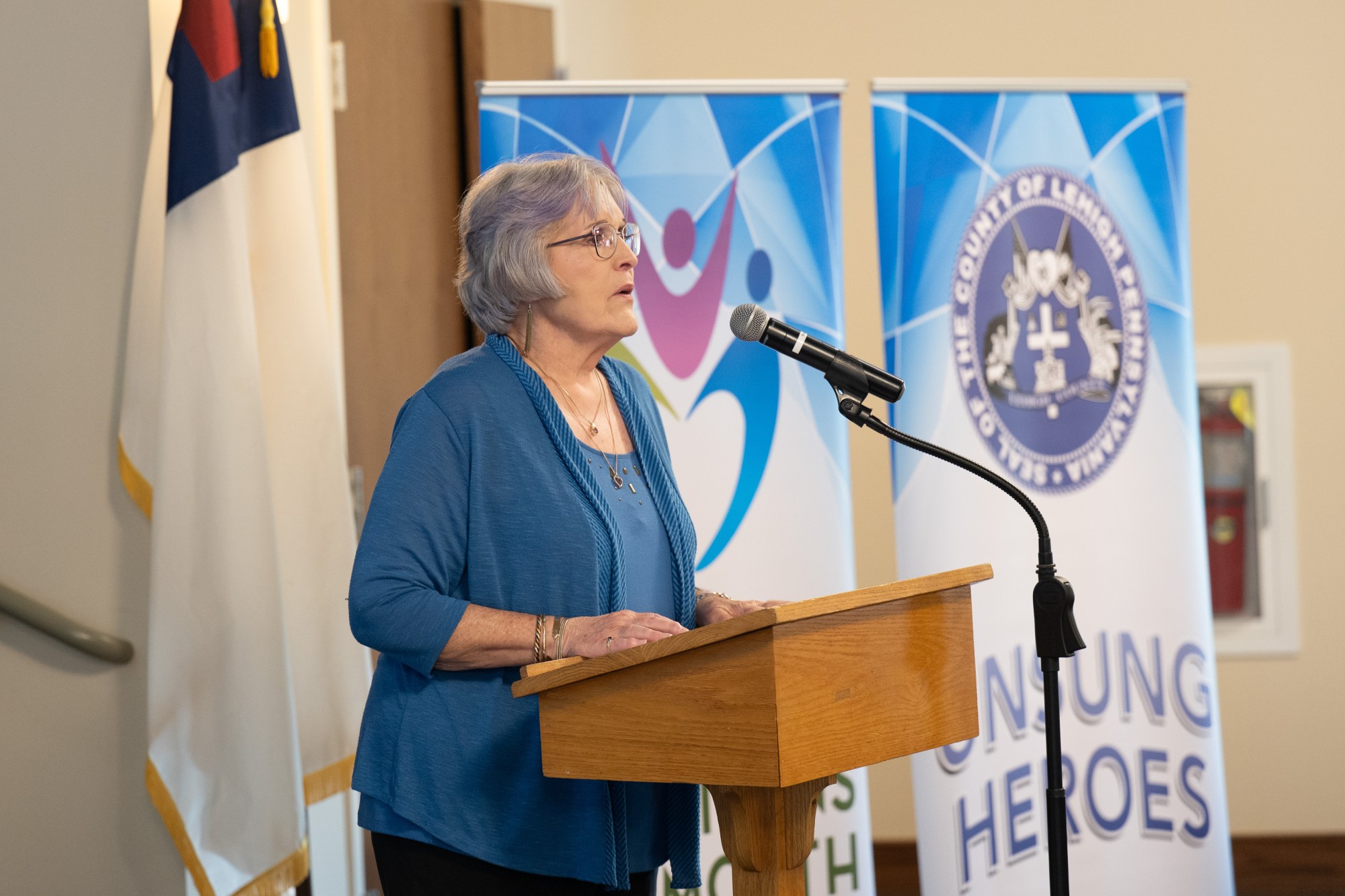 Marianne Werling presents an Unsung Heroes award to Audrey Berg of South Whitehall Township during Lehigh County Aging & Adult Services' 26th annual tribute Wednesday, May 13, 2026, at Fellowship Community's Zentz Center in Whitehall Township. Berg has volunteered as a piano player and vocalist at Fellowship Community for 30 years. The annual tribute recognizes older adults who have enhanced their communities through active engagement, volunteerism and service to others. (Jonathan Broady/Special to The Morning Call)