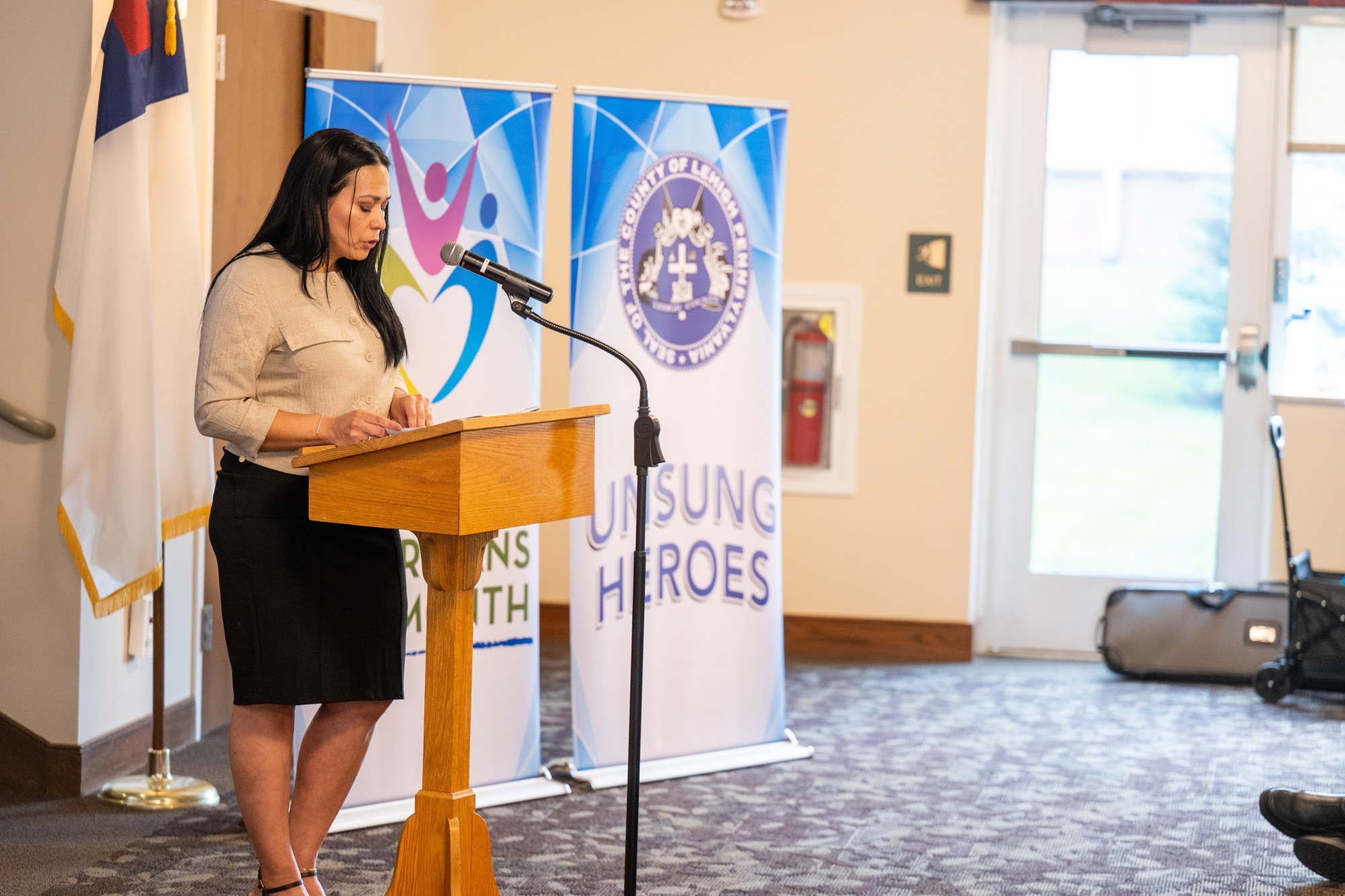 Elizabeth Serrano presents an Unsung Heroes award to Beatriz Garcia of Allentown during Lehigh County Aging & Adult Services' 26th annual tribute Wednesday, May 13, 2026, at Fellowship Community's Zentz Center in Whitehall Township. Garcia is a crafter and volunteer for Casa Gaudalupe. The annual tribute recognizes older adults who have enhanced their communities through active engagement, volunteerism and service to others. (Jonathan Broady/Special to The Morning Call)