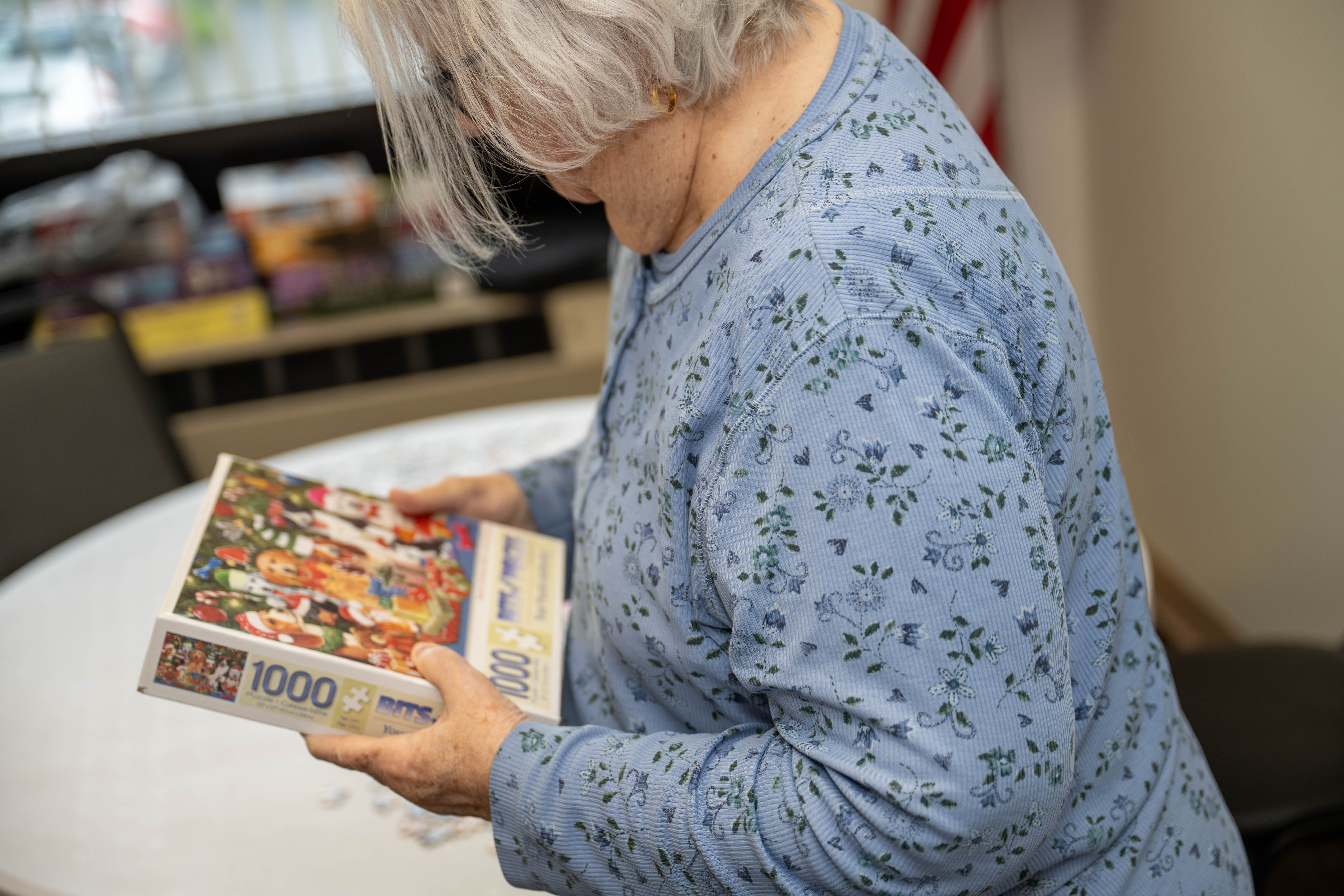 Sandra Lynn looks at a puzzle on Wednesday, May 6,...