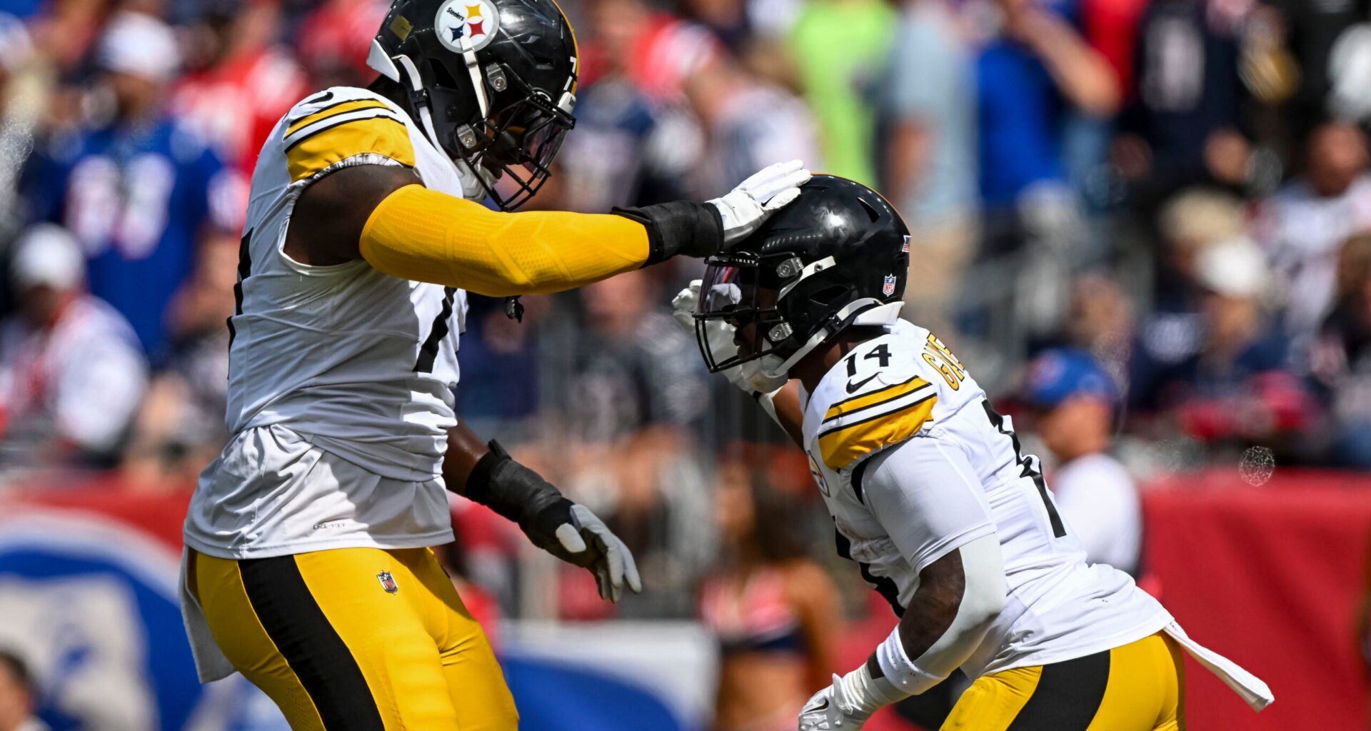 Sep 21, 2025; Foxborough, Massachusetts, USA; Pittsburgh Steelers running back Kenneth Gainwell (14) and Pittsburgh Steelers offensive tackle Broderick Jones (77) react after a touchdown during the first quarter at Gillette Stadium.