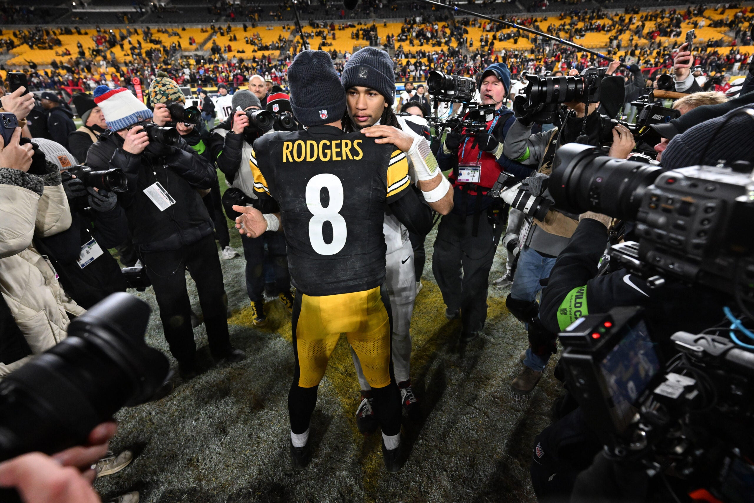 Jan 12, 2026; Pittsburgh, PA, USA; Houston Texans quarterback C.J. Stroud (7) greets Pittsburgh Steelers quarterback Aaron Rodgers following their AFC Wild Card Round game at Acrisure Stadium.