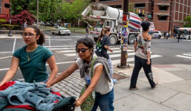 Traffic is jammed in University City Wednesday - in the middle of UPenn move-out day - after a cement truck struck a wire and pulled a utility pole down on a car (rear) stopped at the traffic light.