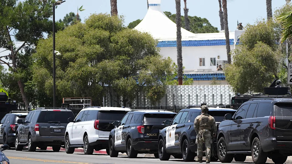 Police stage at the scene of a shooting outside the Islamic Center of San Diego Monday, May 18, 2026, in San Diego. AP Photo/Gregory Bull