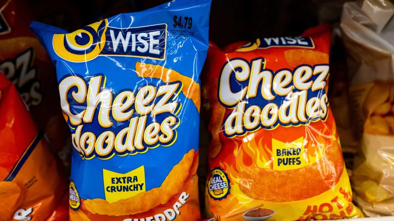 Two bags of Wise Cheese Doodles on a store shelf