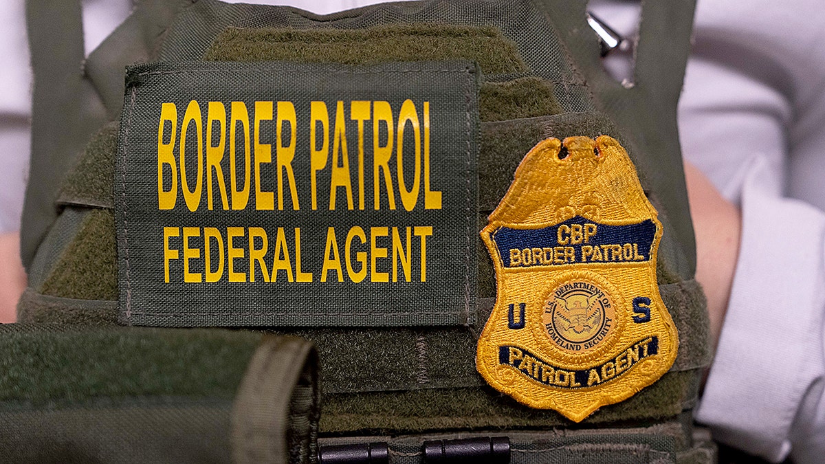 U.S. Customs and Border Patrol agent standing outside Jacob K. Javits Federal Building in New York City