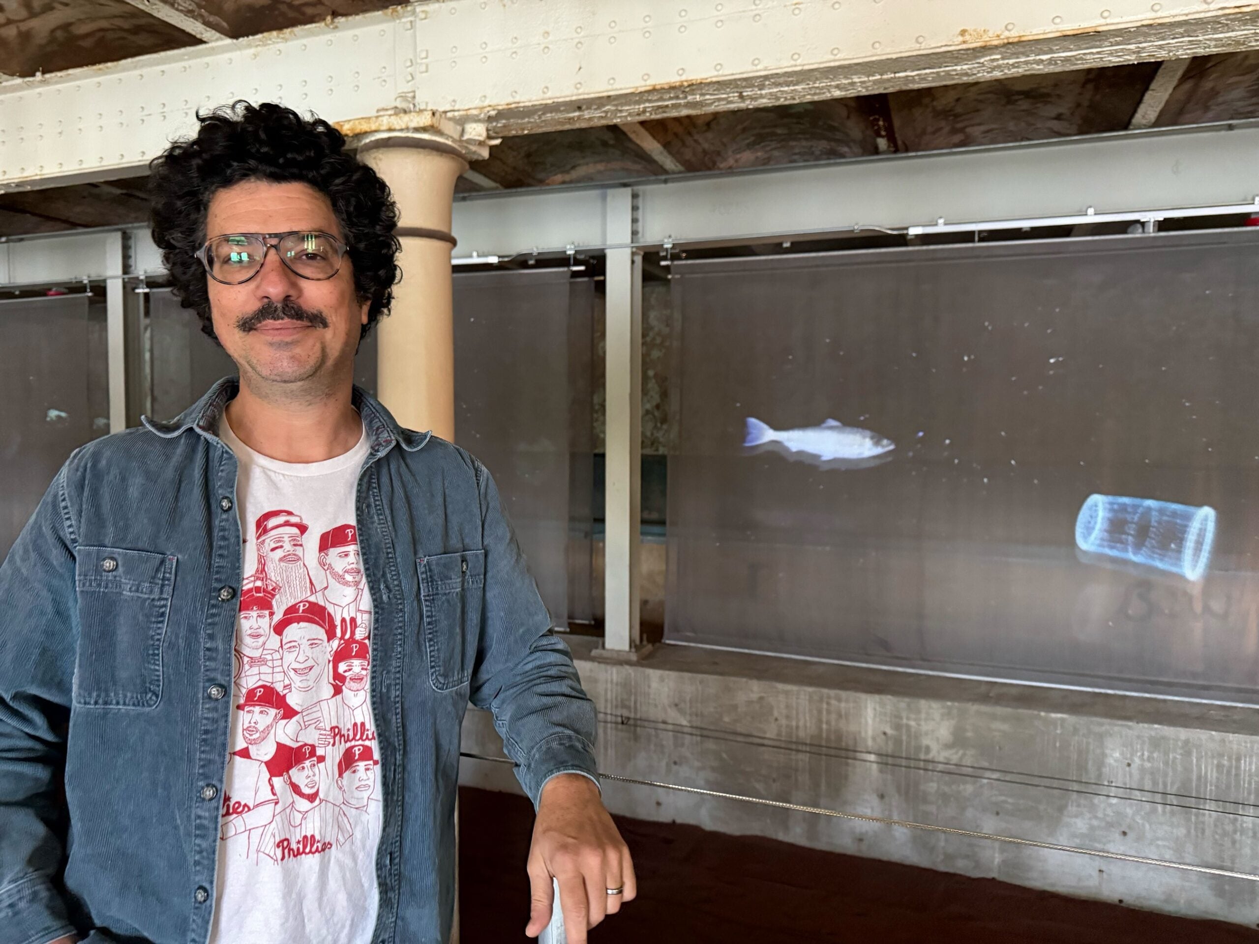 Matthew Suib with an installation he worked on