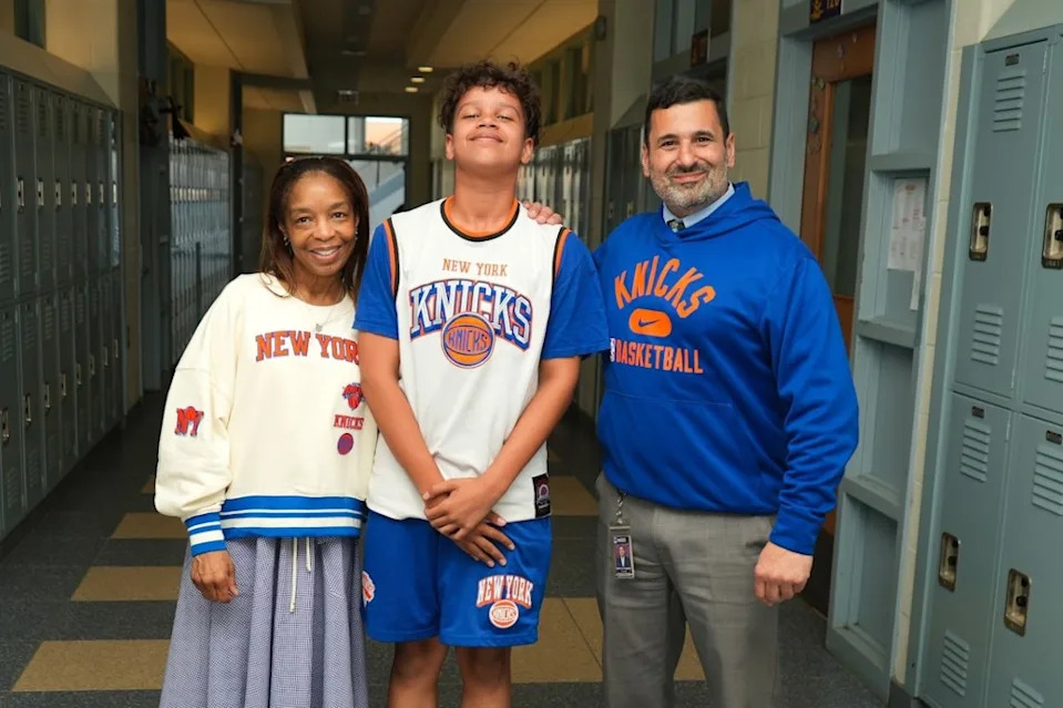 Ralph G. Reed Middle School’s Superintendent Dr. Sharon A. Dungee and principal Anthony Coggiano sportt Knicks gear with a student. Obtained by NYPost