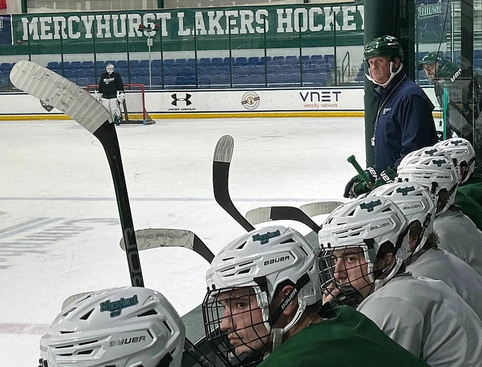 Mercyhurst University men's hockey coach Rick Gotkin (standing, green helmet) watches the Lakers during their Sept. 17, 2024, practice at the Mercyhurst Ice Center. Here, a reader urges the school to add more parking to boost attendance at events on campus.