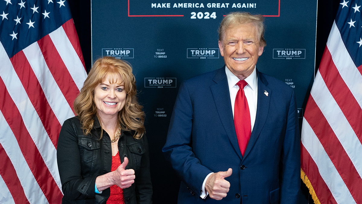 Pennsylvania state treasurer Stacy Garrity posing with then-candidate President Donald Trump
