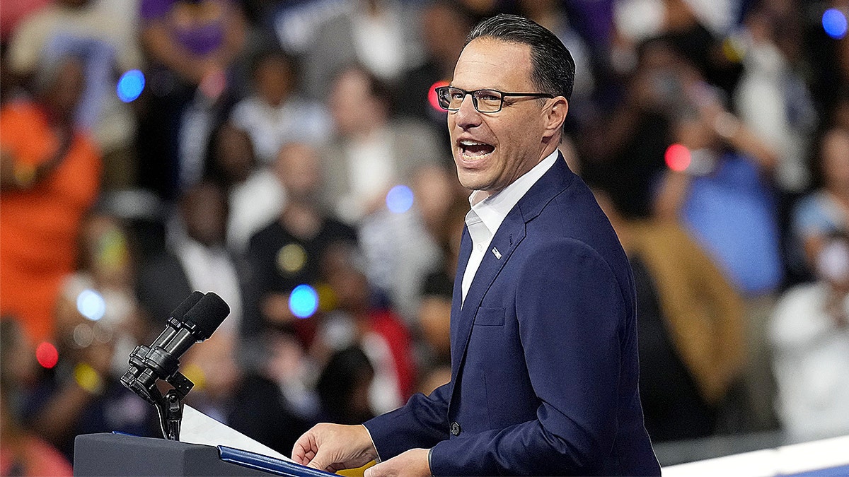 Democratic Gov. Josh Shapiro greeting crowd at campaign rally in Philadelphia