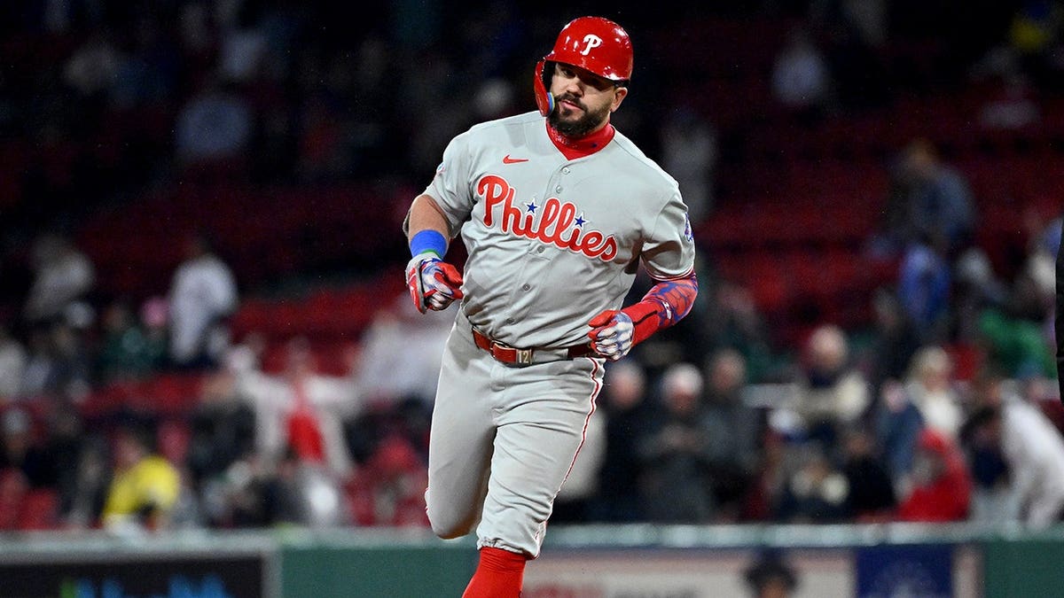 Kyle Schwarber running bases after hitting a home run at Fenway Park